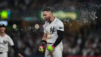 Yankees clinch playoff spot with walk-off win, close gap in AL East - ESPN