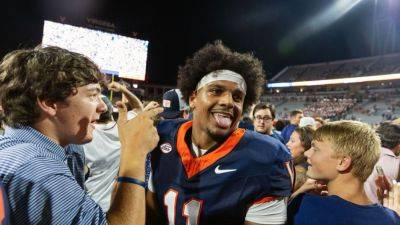 Virginia prevails in 2OT after Florida State's end-zone bobble - ESPN