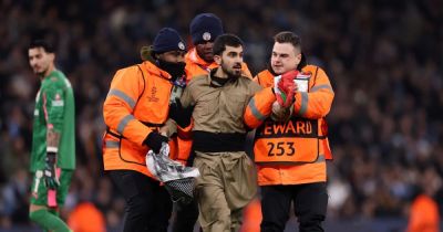 Man City Champions League clash stopped as protesters suddenly storm pitch