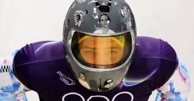 IOC urges Ukrainian racer to compete amid row over banned war victim helmet