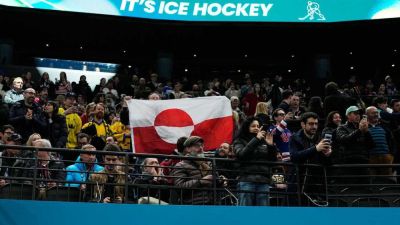 Olympic hockey fans raise Greenland's flag during USA's dominant win over Denmark, sparking viral reaction