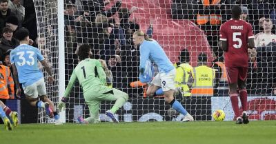 Late Erling Haaland penalty keeps Man City in title race as they beat Liverpool