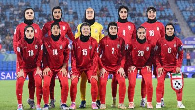 Iran wrestling champion speaks out against country's treatment of female athletes amid soccer player concerns