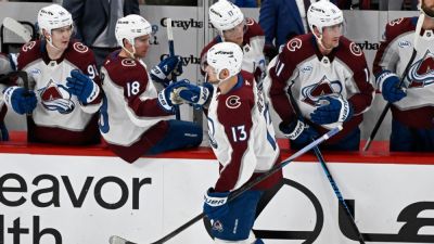 Avs become 1st NHL team to clinch playoff berth, beat Blackhawks - ESPN