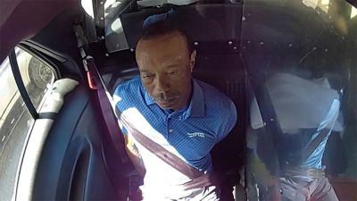 Tiger Woods utters sarcastic 3-word remark after getting placed in back of cop car during DUI arrest