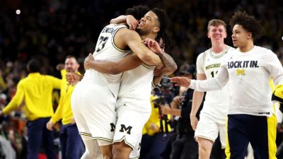 Michigan holds off UConn, wins second NCAA basketball title - ESPN