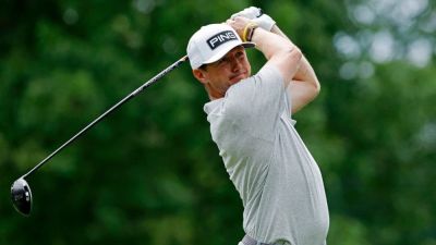 Joe Robbins - Golfer Mackenzine Hughes sticks a tee shot on the green after it bounces off a cameraman's head - foxnews.com