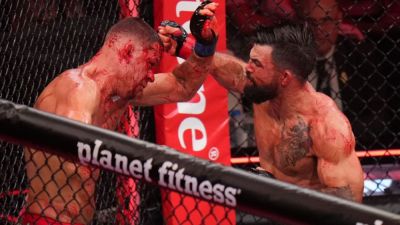 Mike Perry batters, bloodies Nate Diaz into corner stoppage - ESPN