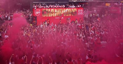 Arsenal put Champions League defeat behind them with open-top bus parade