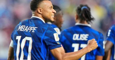 Kylian Mbappe adds two more to tally in storm-delayed win over Iraq