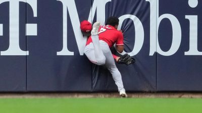 Reds' Dane Myers carted off field after crashing into wall making acrobatic catch vs Brewers - foxnews.com