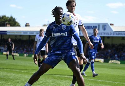 Defender Shad Ogie joins Woking after Gillingham exit and Jonny Williams heads to Swindon Town for a trial