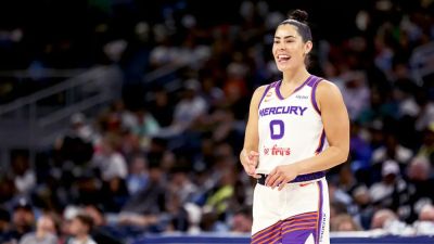 Social media explodes as WNBA star Kelsey Plum leaps into the arms of opposing coach during play